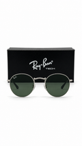 Ray-Ban RB3447 Round Metal Sunglasses – Silver Frame, Green Lenses