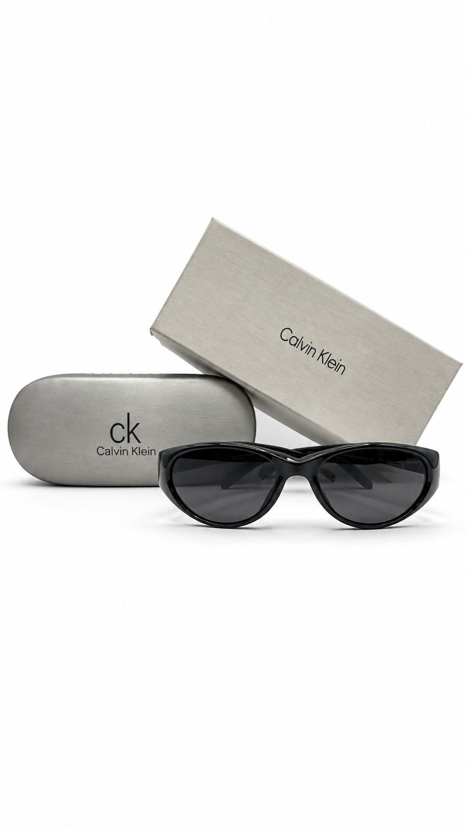 Calvin Klein CKJ24638SLB 001 54mm Shiny Black Oval Sunglasses Grey Lenses Gold cK Logo